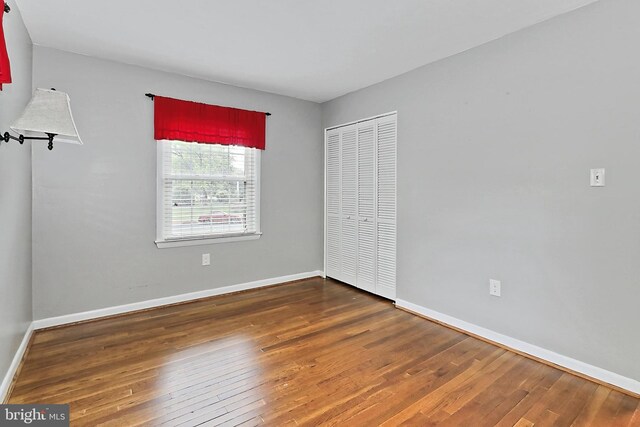 4500 Hadrian Ct, Alexandria, VA 22310 - unfurnished bedroom featuring hardwood / wood-style flooring, baseboards, and a closet