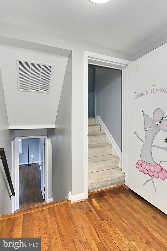 4500 Hadrian Ct, Alexandria, VA 22310 - staircase featuring wood finished floors and baseboards