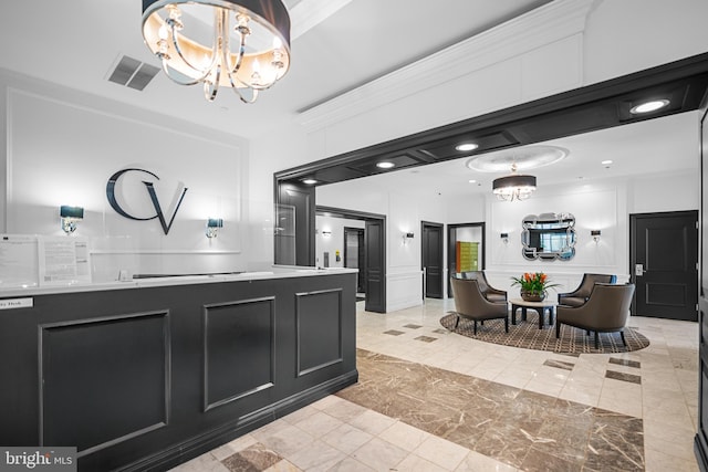 reception area featuring visible vents and a chandelier