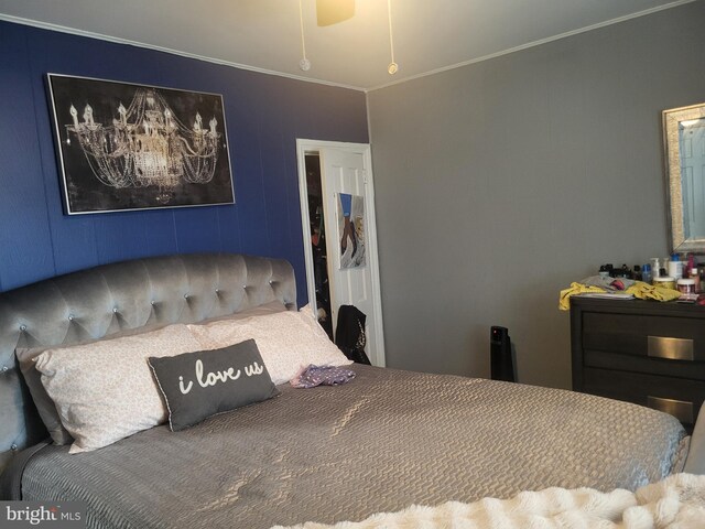 bedroom with crown molding