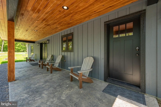 17 Green Jacket Ct, Mc Henry, MD 21541 - view of exterior entry featuring board and batten siding and covered porch