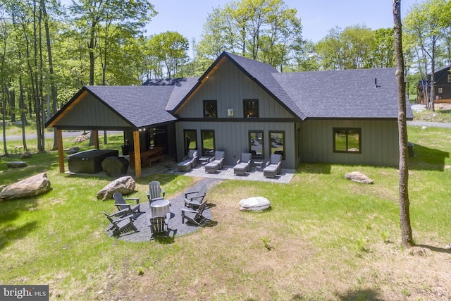 17 Green Jacket Ct, Mc Henry, MD 21541 - back of property featuring an outdoor living space with a fire pit, a lawn, a patio area, and roof with shingles