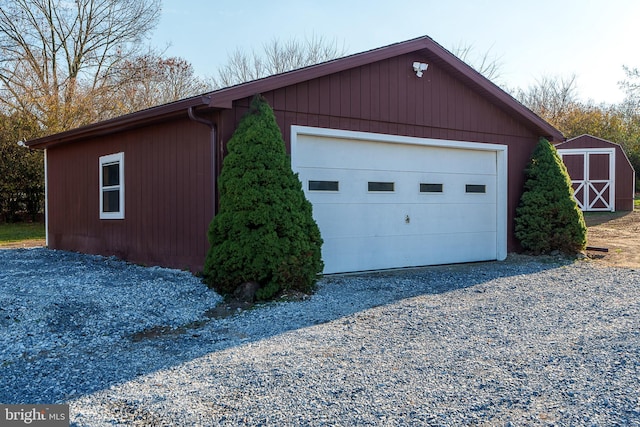 detached garage featuring a storage unit