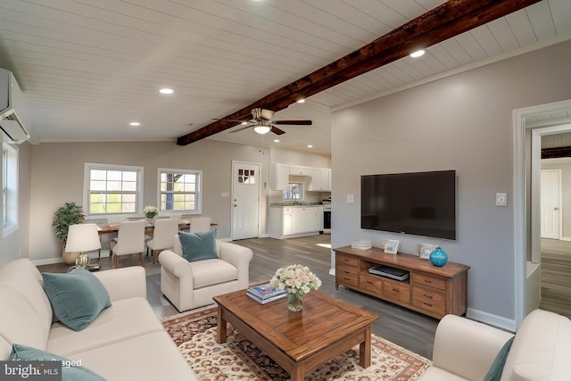 living room with wood finished floors, vaulted ceiling with beams, ceiling fan, baseboards, and recessed lighting