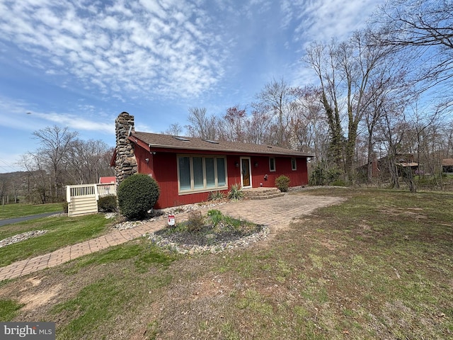 711 Clymer Ave, Sellersville, PA 18960 - view of front of house with a chimney and a front yard