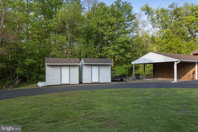 711 Clymer Ave, Sellersville, PA 18960 - garage with a storage unit and asphalt driveway