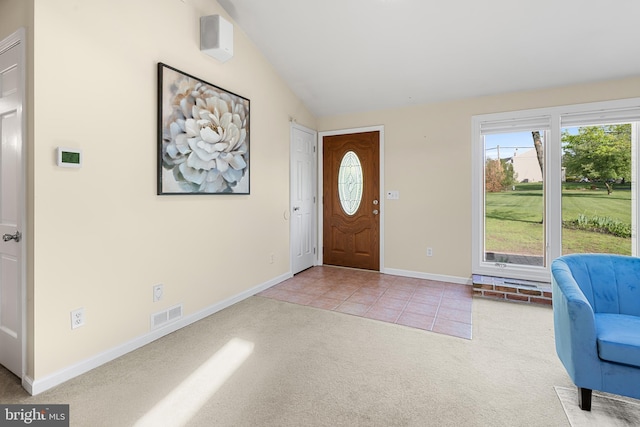 711 Clymer Ave, Sellersville, PA 18960 - carpeted foyer entrance featuring vaulted ceiling, plenty of natural light, baseboards, and tile patterned floors