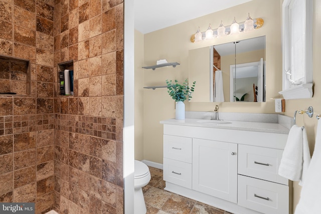 711 Clymer Ave, Sellersville, PA 18960 - full bathroom featuring tiled shower, vanity, toilet, and stone tile floors