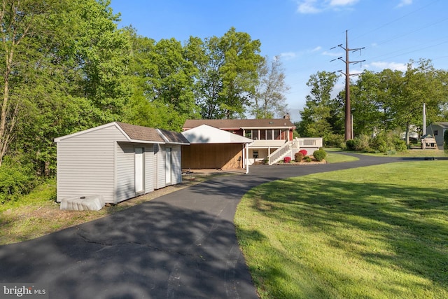 711 Clymer Ave, Sellersville, PA 18960 - view of front of property with an outbuilding, a shed, a front yard, and stairway