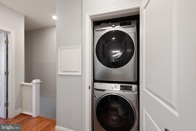 728 Farragut St NW, Washington, DC 20011 - laundry room with laundry area, stacked washer and dryer, and light wood-style flooring