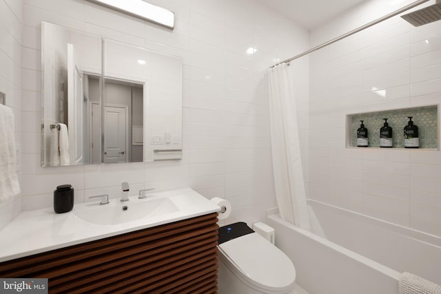 728 Farragut St NW, Washington, DC 20011 - bathroom featuring toilet, tile walls, shower / bathtub combination with curtain, and vanity