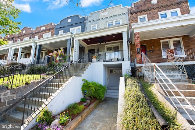 728 Farragut St NW, Washington, DC 20011 - townhome / multi-family property featuring a porch, brick siding, fence, and stairway