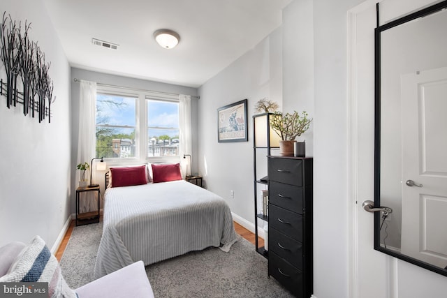 728 Farragut St NW, Washington, DC 20011 - bedroom featuring baseboards, wood finished floors, and visible vents