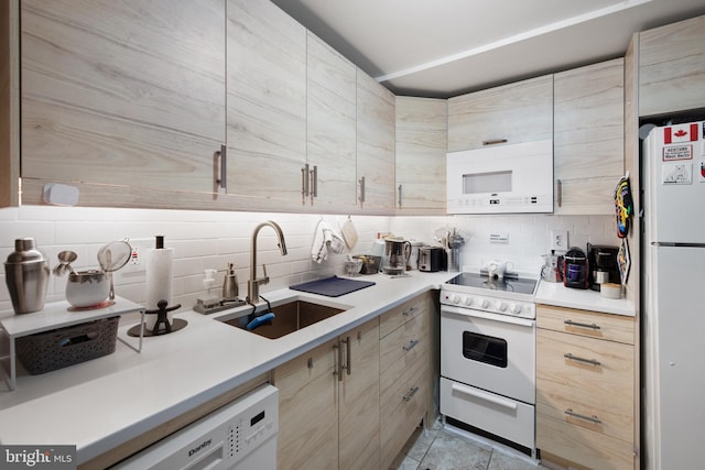 728 Farragut St NW, Washington, DC 20011 - kitchen featuring decorative backsplash, light brown cabinetry, a sink, light countertops, and white appliances