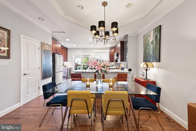 728 Farragut St NW, Washington, DC 20011 - dining room featuring crown molding, baseboards, recessed lighting, and a notable chandelier