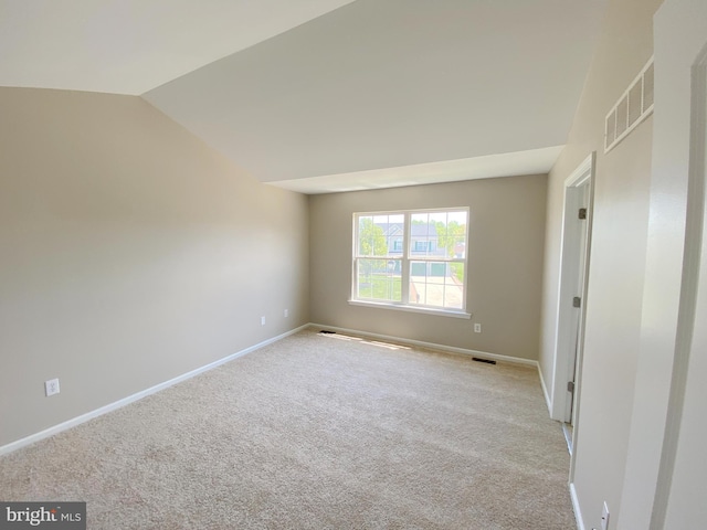 190 Wynnefield Rd, Bear, DE 19701 - unfurnished bedroom with carpet floors, baseboards, vaulted ceiling, and visible vents