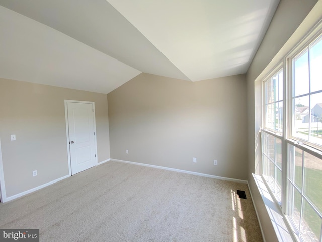 190 Wynnefield Rd, Bear, DE 19701 - unfurnished room featuring baseboards, visible vents, carpet, and lofted ceiling