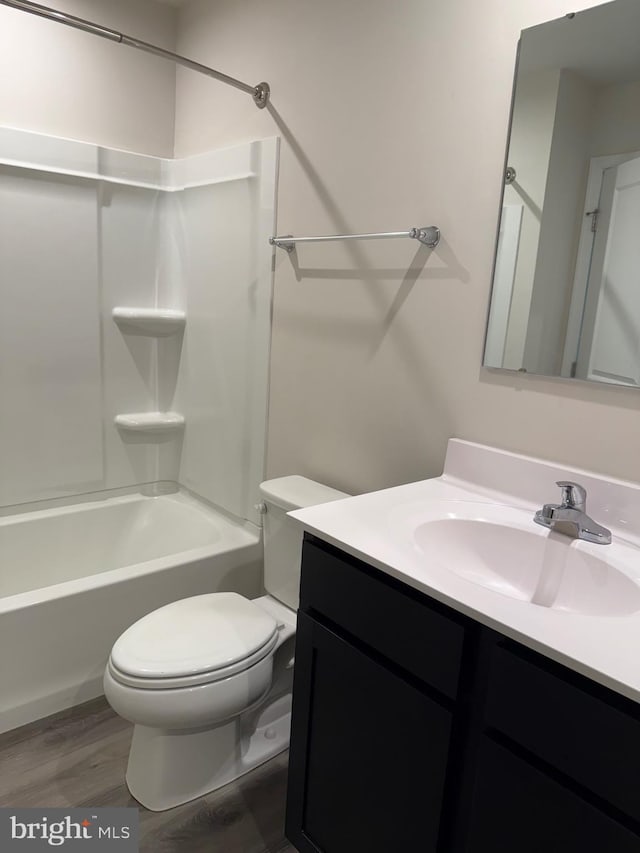 506 Red Bill Ln, Cambridge, MD 21613 - full bath featuring wood finished floors, vanity, toilet, and tub / shower combination