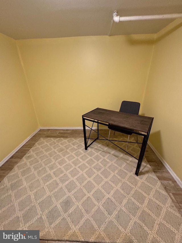 carpeted office space with baseboards