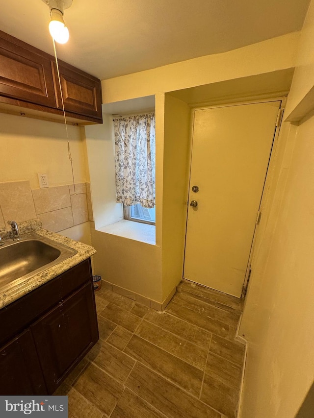 laundry area with a sink
