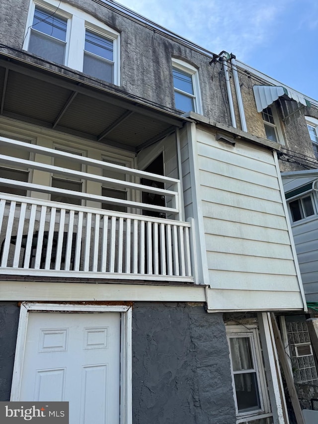 view of property exterior featuring a balcony