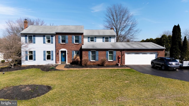 20 Eagle Ct, Gilbertsville, PA 19525 - colonial home with a front lawn, driveway, a chimney, and a garage