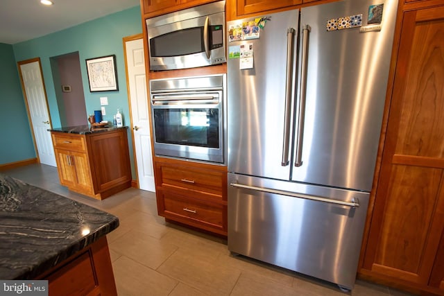 20 Eagle Ct, Gilbertsville, PA 19525 - kitchen with recessed lighting, brown cabinetry, tile patterned floors, and stainless steel appliances