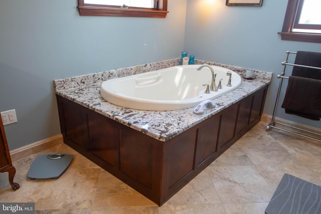 20 Eagle Ct, Gilbertsville, PA 19525 - bathroom with a garden tub and baseboards