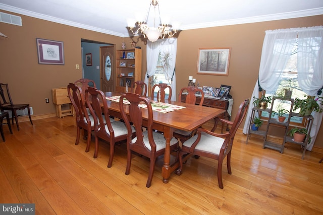 20 Eagle Ct, Gilbertsville, PA 19525 - dining area featuring an inviting chandelier, crown molding, visible vents, and a wealth of natural light