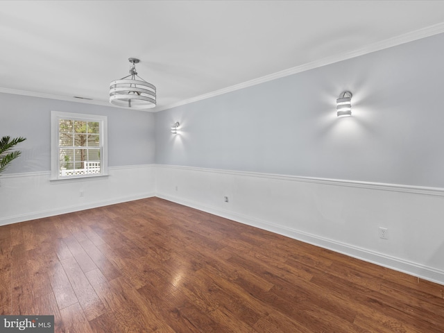 unfurnished dining area featuring dark wood-type flooring and crown molding