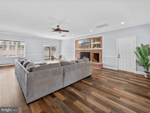 living area featuring a ceiling fan, dark wood finished floors, baseboards, a brick fireplace, and recessed lighting