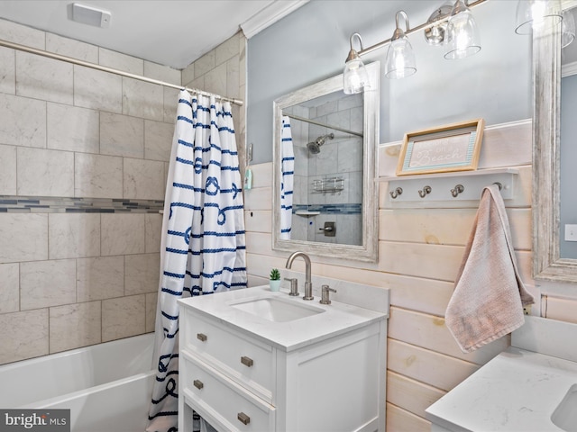 bathroom with shower / bathtub combination with curtain and vanity