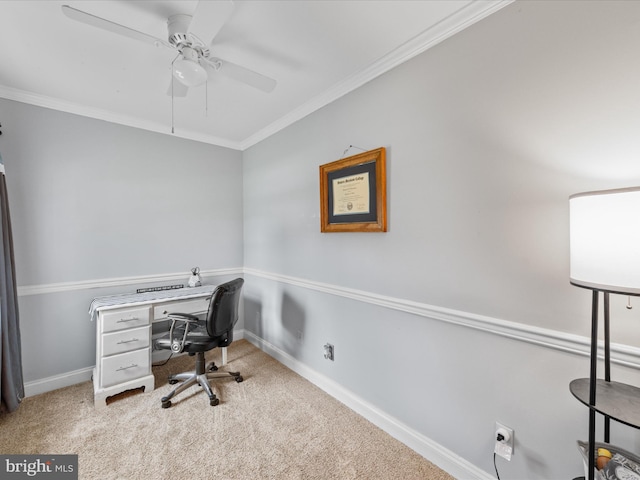 office area with carpet, crown molding, baseboards, and a ceiling fan