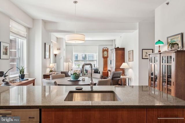 1425 Locust St Unit 10C, Philadelphia, PA 19102 - kitchen with a sink, open floor plan, dark stone countertops, and stainless steel dishwasher