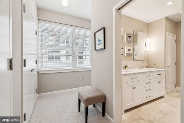 1425 Locust St Unit 10C, Philadelphia, PA 19102 - bathroom featuring backsplash, vanity, and baseboards