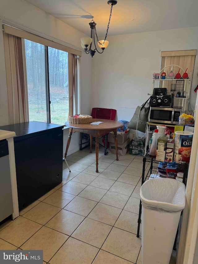 3322 Windermere Dr, Bushkill, PA 18324 - dining area with a chandelier and light tile patterned floors