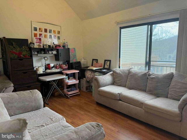 3322 Windermere Dr, Bushkill, PA 18324 - living area featuring lofted ceiling and wood finished floors