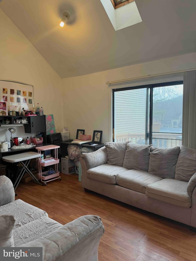 3322 Windermere Dr, Bushkill, PA 18324 - living room featuring wood finished floors and lofted ceiling with skylight