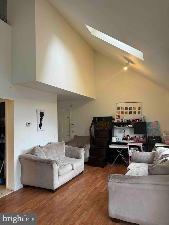 3322 Windermere Dr, Bushkill, PA 18324 - living area featuring high vaulted ceiling, wood finished floors, and a skylight