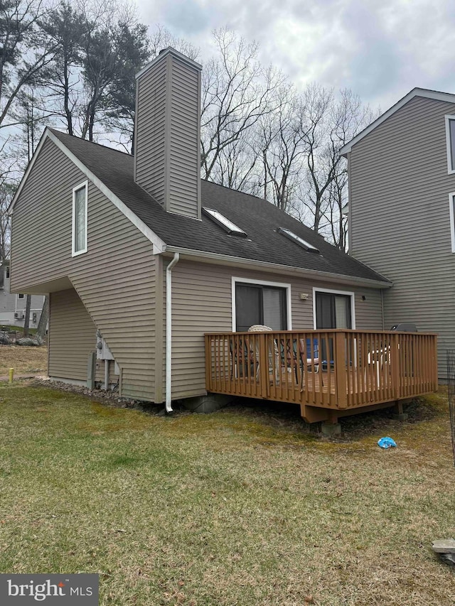 3322 Windermere Dr, Bushkill, PA 18324 - back of house with a wooden deck, a lawn, a chimney, and roof with shingles