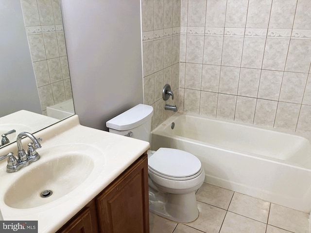 full bathroom with tile patterned flooring, toilet, vanity, and shower / tub combination