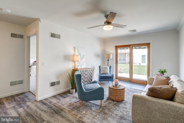 sitting room featuring wood finished floors and visible vents