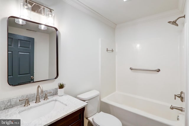 bathroom with washtub / shower combination, toilet, vanity, and ornamental molding