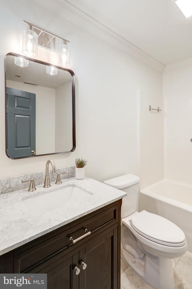 bathroom featuring crown molding, vanity, and toilet