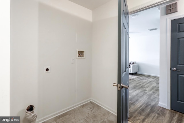 laundry room featuring laundry area, visible vents, hookup for a washing machine, baseboards, and electric dryer hookup