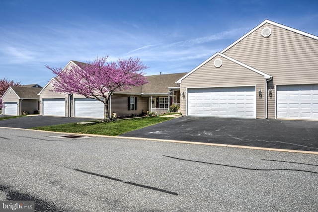 view of front of property with driveway and a garage