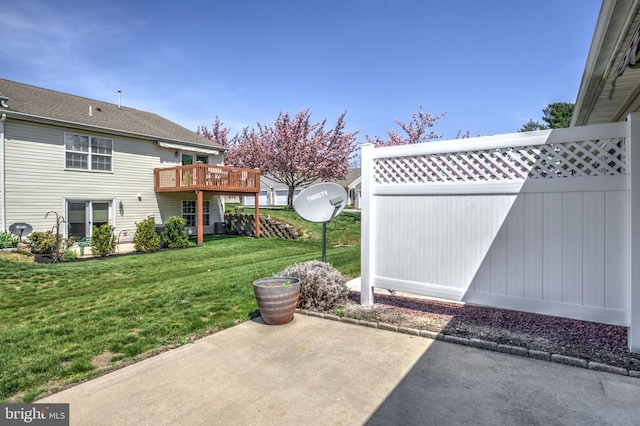 exterior space featuring fence, a deck, and a patio