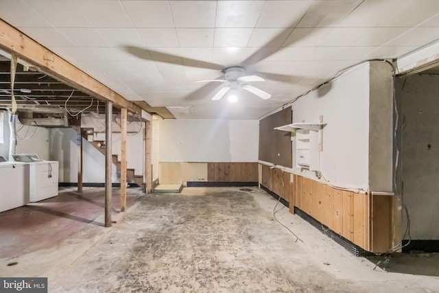below grade area with washing machine and dryer, a ceiling fan, and stairway