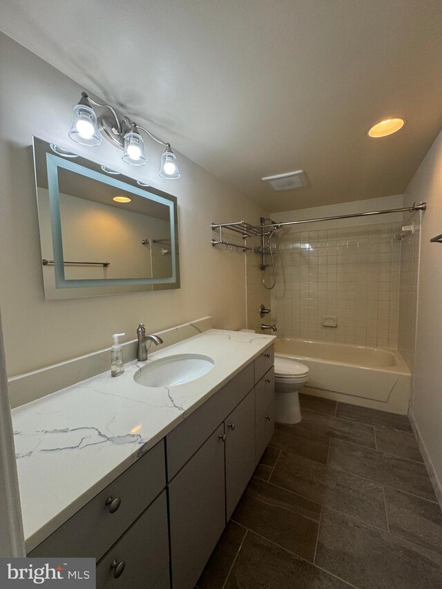803 N Howard St Unit 435, Alexandria, VA 22304 - bathroom featuring vanity, bathing tub / shower combination, and toilet