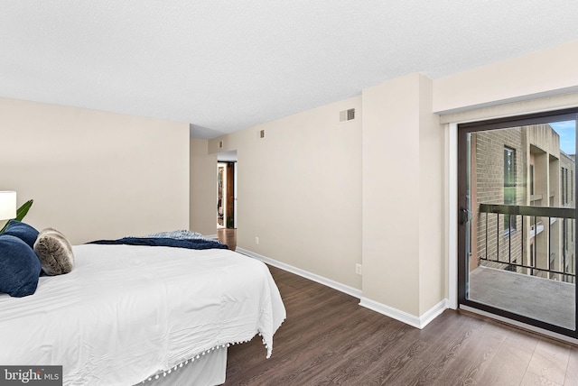 803 N Howard St Unit 435, Alexandria, VA 22304 - bedroom with wood finished floors, access to exterior, and baseboards